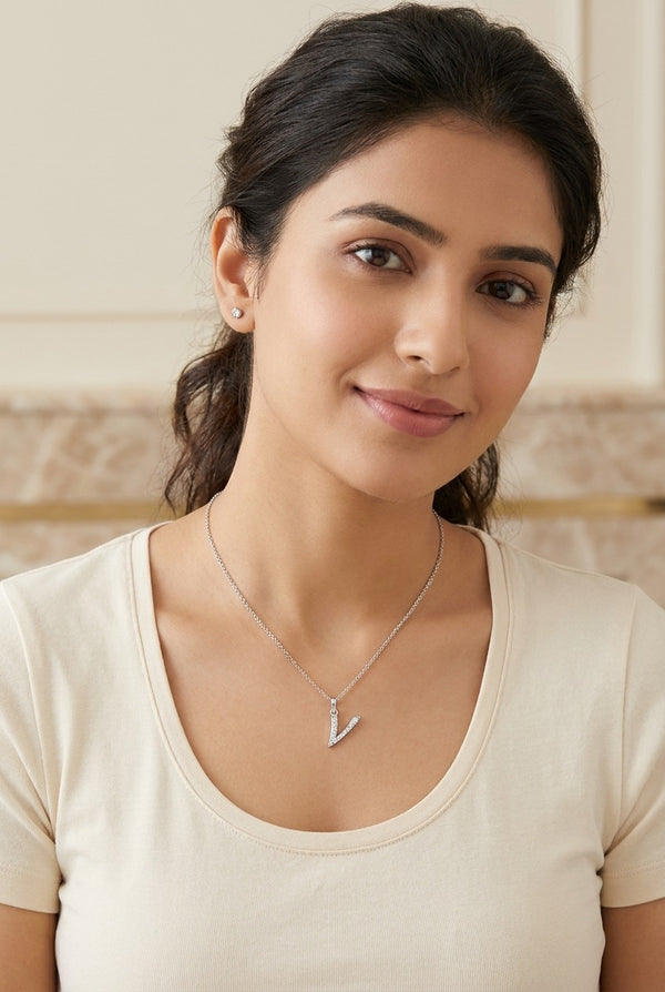 GEMHUB model wearing initial V pendant