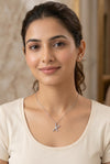 GEMHUB model wearing initial X pendant