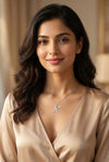 GEMHUB model wearing initial X pendant