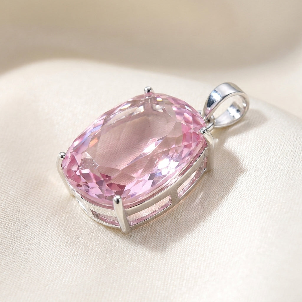 GEMHUB Pink Topaz Cushion 86.45 Ct pendant side view on silk (AI)