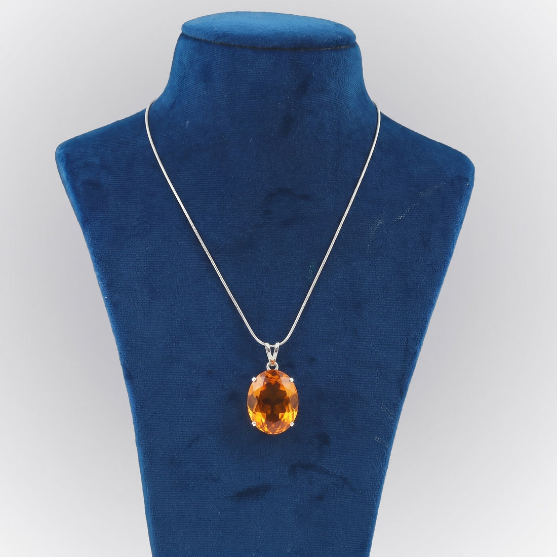 GEMHUB Yellow Citrine Oval 105 Ct lab-grown gemstone pendant on display bust (AI render)