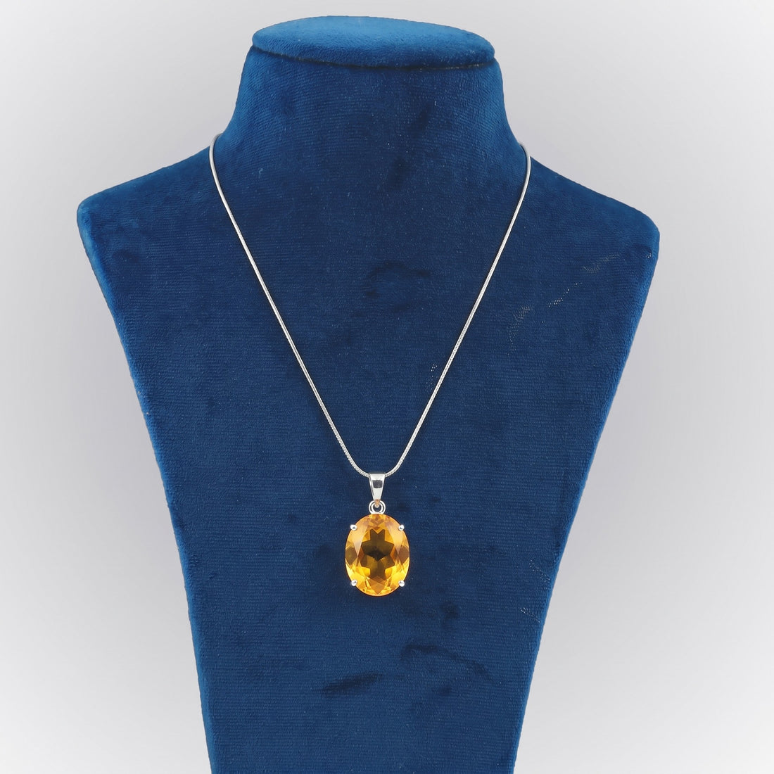 GEMHUB Yellow Citrine Oval 65 Ct lab-grown gemstone pendant on display bust (AI render)