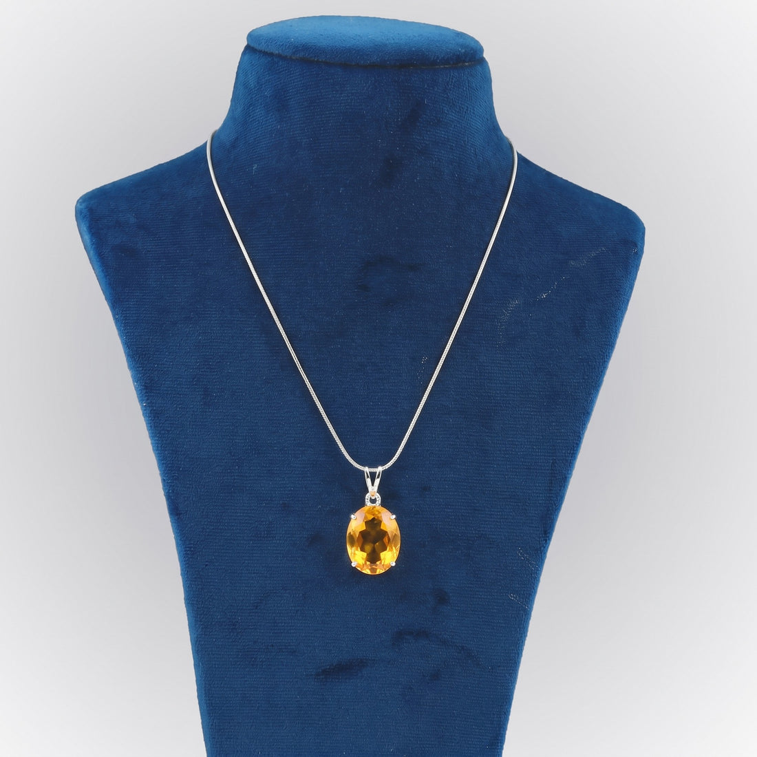 GEMHUB Yellow Citrine Oval 80 Ct lab-grown gemstone pendant on display bust (AI render)